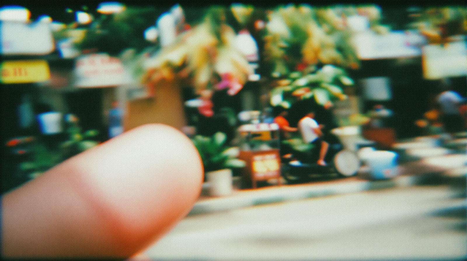 A deliberately bad snapshot: blurred, motion-smeared and half covered by a thumb